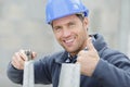 Happy construction bricklayer worker outdoors