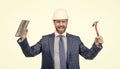 Happy construction man wear safety helmet with formal suit holding hammer and trowel, building Royalty Free Stock Photo