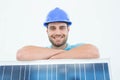 Happy construction worker leaning on solar panel Royalty Free Stock Photo