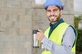 happy constructor holding coffee cup