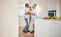 Happy, cooking or elderly couple dance in the kitchen together and feeling love, excited and bonding in home. Care