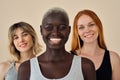 Happy cool gen z Black blonde girl with diverse models on background, portrait.