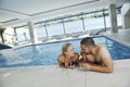 Happy cople relaxing at swimming pool Royalty Free Stock Photo