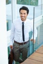 Happy, corporate and professional with a business man on stairs in a modern at work for progress. Smile, staircase and Royalty Free Stock Photo