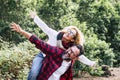 Happy couple of adult people caucasian man and woman have fun together in. outdor leisure activity in the nature- environment and