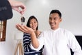 Happy couple asian buy their new home and receiv key from real estate agent Royalty Free Stock Photo