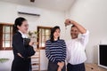 Happy couple asian buy their new home and receiv key from real estate agent Royalty Free Stock Photo