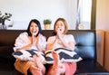 Happy couple asian woman watching TV feeling having fun .together at home Royalty Free Stock Photo