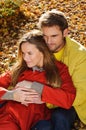 Happy Couple in Autumn Park. Fall. Young Family Having Fun Outdoors. Yellow Trees and Leaves. Laughing Man and Woman outside. Free Royalty Free Stock Photo