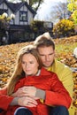 Happy Couple in Autumn Park. Fall. Young Family Having Fun Outdoors. Yellow Trees and Leaves. Laughing Man and Woman outside. Free Royalty Free Stock Photo