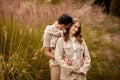 Happy couple on autumn walk outdoors. Two lovers in autumn park. Love and tender touch. Gentle hugs. Young man and woman Royalty Free Stock Photo