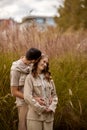 Happy couple on autumn walk outdoors. Two lovers in autumn park. Love and tender touch. Gentle hugs. Young man and woman Royalty Free Stock Photo