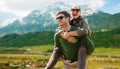 Happy couple with backpacks traveling in highlands Royalty Free Stock Photo