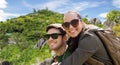 Happy couple with backpacks traveling Royalty Free Stock Photo