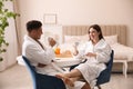 Happy couple in bathrobes having breakfast Royalty Free Stock Photo