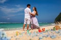 Happy Couple, at Beach, Holds Hands, Sea. Travel at Hawaii. Royalty Free Stock Photo