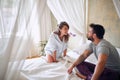 Happy couple in bed showing emotions and love.Romantic young couple in love on bed Royalty Free Stock Photo