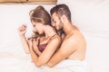 Happy couple in bed Royalty Free Stock Photo