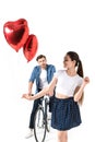 Couple with bicycle and balloons