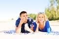 Happy couple blowing bubbles at the beach