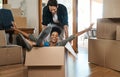 Happy couple, box and fun for moving to new home, real estate property and celebrate together. Excited man, woman and Royalty Free Stock Photo