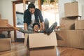 Happy couple, box and real estate moving in house or property in renovation or investment together. Interracial man and Royalty Free Stock Photo