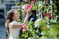 Happy couple bride and groom tender caress in wedding day in Italy