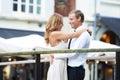 Happy couple, bridge and hug outdoor with love, care and romantic valentines date with happiness together. Man, woman Royalty Free Stock Photo