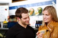 Happy couple in butcher shop Royalty Free Stock Photo