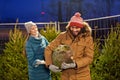 Happy couple buying christmas tree at market Royalty Free Stock Photo