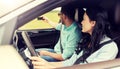 Happy couple in car taking selfie with smartphone Royalty Free Stock Photo