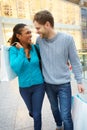 Happy Couple Carrying Bags In Shopping Mall Royalty Free Stock Photo