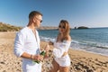 Happy couple with champagne on the beach. Summer vacations concept. Top view Royalty Free Stock Photo