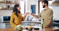 Happy couple, champagne and cheers in kitchen for anniversary, date or celebration together at home. Man and woman in