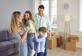 Happy couple with children moving into new house Royalty Free Stock Photo
