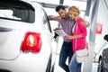 Happy couple chooses to buy a car