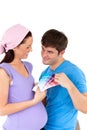 Happy couple choosing colors for their baby room Royalty Free Stock Photo