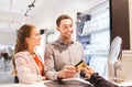 Happy couple choosing engagement ring in mall Royalty Free Stock Photo