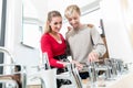 Happy couple choosing a new faucet in a modern sanitary ware shop Royalty Free Stock Photo