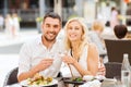 Happy couple clinking glasses at restaurant lounge
