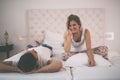 Happy couple conversation in bed Royalty Free Stock Photo