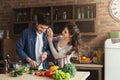 Happy couple cooking dinner together Royalty Free Stock Photo