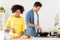 Happy couple cooking food at home kitchen Royalty Free Stock Photo