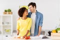 Happy couple cooking food at home kitchen Royalty Free Stock Photo