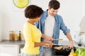 Happy couple cooking food at home kitchen Royalty Free Stock Photo