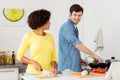 Happy couple cooking food at home kitchen Royalty Free Stock Photo