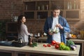 Happy couple cooking healthy food together Royalty Free Stock Photo