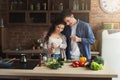 Happy couple cooking healthy food together Royalty Free Stock Photo