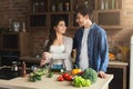 Happy couple cooking healthy food together Royalty Free Stock Photo