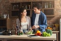 Happy couple cooking healthy food together Royalty Free Stock Photo